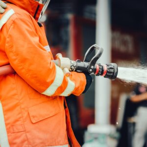 Firefighter using firehose