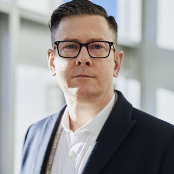 man in suit wearing glasses portrait 