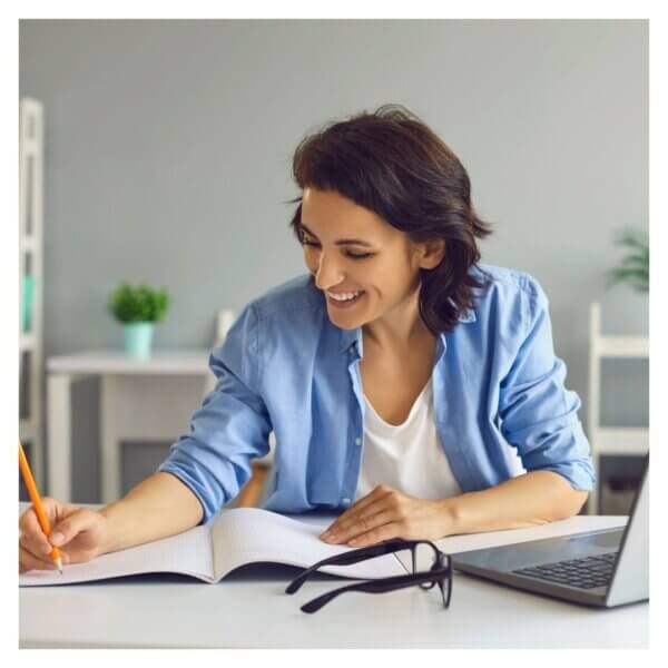 woman working on an online firefighter test prep course