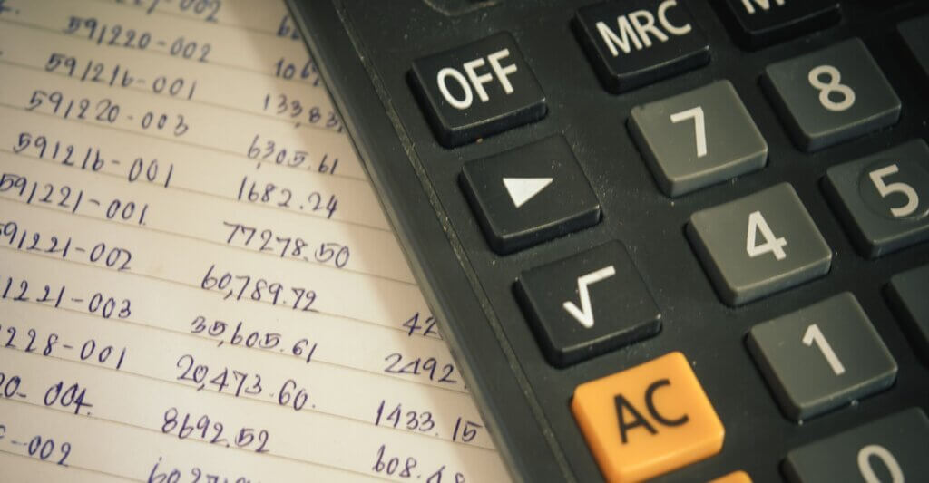 sheet of numbers with calculator